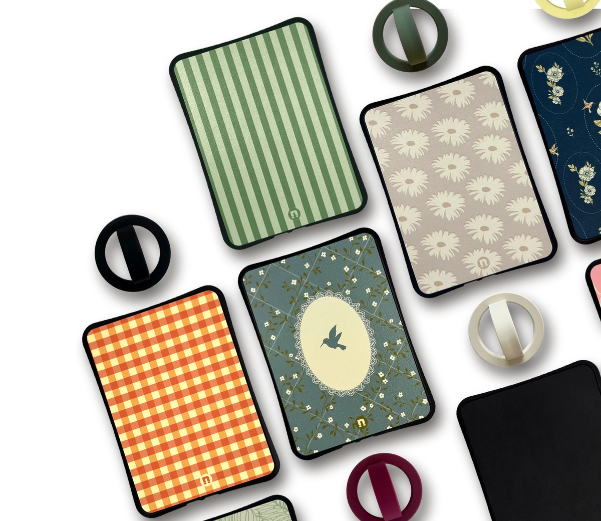 Bondi cases laid out side by side with loose grips, including the Hummingbird case