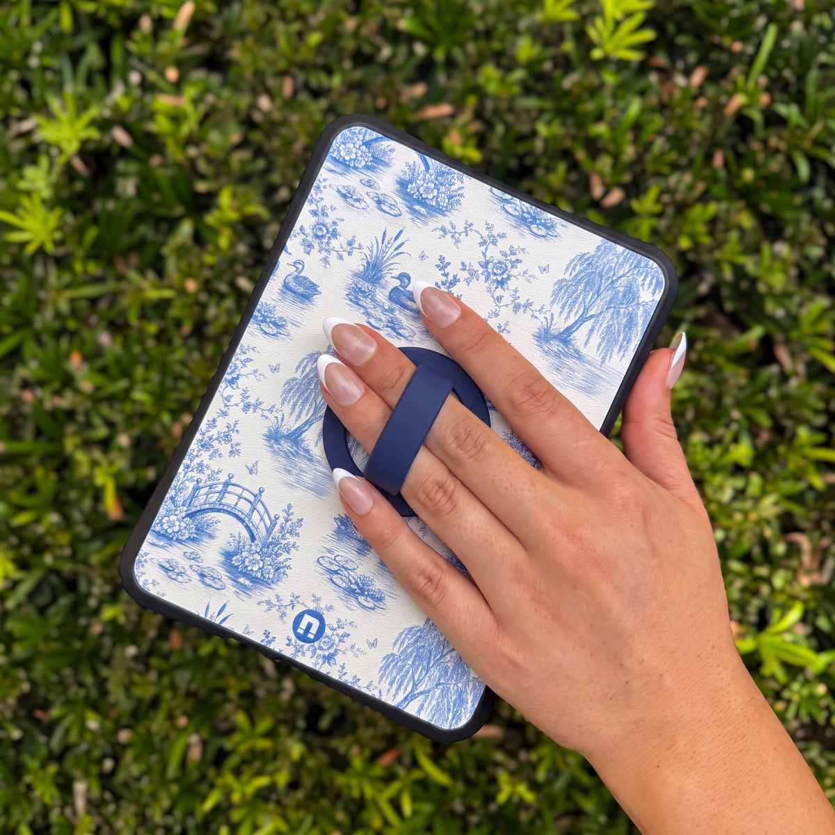 Hand holding a Bondi case by the grip: Navy Blue Grip on The Duck Pond case